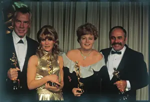 Oscars Winners Holding Their Awards