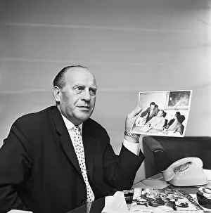 Philanthropist Prints: Oskar Schindler Hold Photos of Holocaust