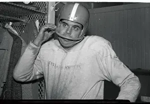 Otto Graham Holding Football Face Guard
