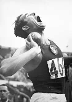 Otto Grigalka Grimacing During Shot Put Event at The Olympics