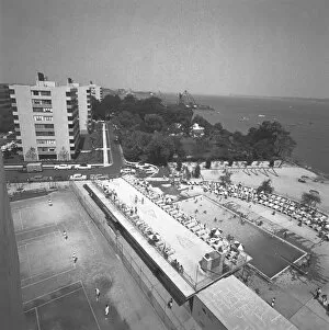 Outdoors swimming pool at seashore, (B&W), elevated view