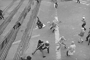 Overhead View of Policemen Fighting Demonstrators