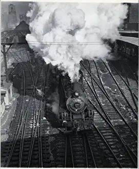 Traveling Prints: Overhead View of Train Going Down Tracks