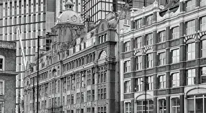Overlapping facades of old and new office buildings in London, England