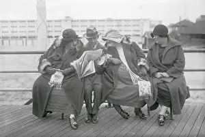 Overweight sisters crowding man on bench