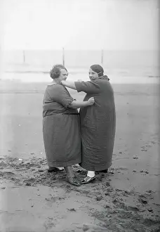 Overweight women sparring at beach. November 02, 1925
