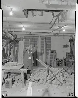 Owner Standing in Ruins of Store