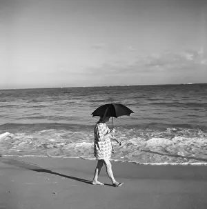 Pablo Cassals Strolling Along Beach