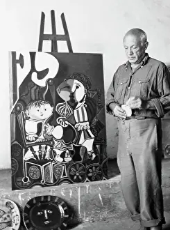 Pablo Picasso Posing with Painting
