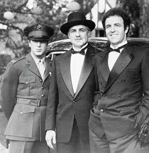 Prints of Al Pacino (as younger son Michael Corleone), Marlon Brando (as father Vito Corleone) and James Caan (as eldest son Sonny Corleone), in costume for the opening scene of The Godfather The Iconic Moments Captured: Pacino, Brando and Caan In Godfather