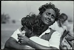 Pakistani Man Sobs On Shoulder Of Friend
