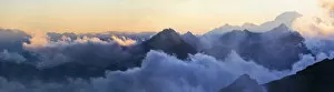 Panorama of the Alps at sunset in the fog, from Mantova Hut, Monte Rosa, Alps, Valle dAosta, Italy