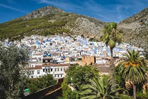 Panoramic aerial view of Chefchaouen city skyline in front of the Rif mountains, Morocco
