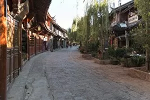 Images Dated 13th November 2016: Panoramic view of Lijiang Old Town at sunset and some tourists walking by