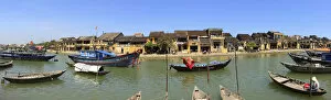 panoramic view of old town and river with boats