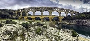 UNESCO World Heritage Gallery: Panoramic view of the Pont du Gard in march at dusk, southern France