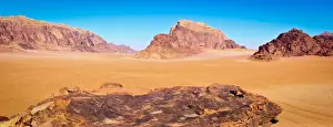 Bedoin Prints: Panoramic view of Wadi Rum from a hilltop with clear blue sky background