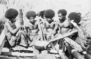 Papuan Men Eating Meal