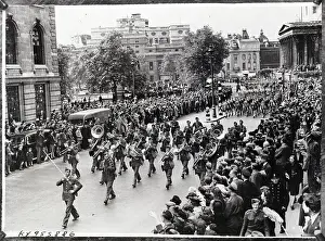 Parade; Band, Soldiers, Crowds On Sidewa