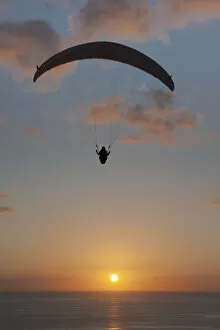 Images Dated 31st January 2012: Paraglider over the Atlantic Ocean with sunset, Canary Islands, Spain