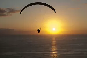 Images Dated 31st January 2012: Paraglider over the Atlantic Ocean with sunset, Canary Islands, Spain