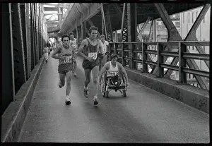 Paraplegic Races in Wheelchair in Marathon