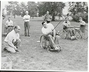 Challenge Prints: Paraplegics Instructor Teaching Golf Skills from His Chair