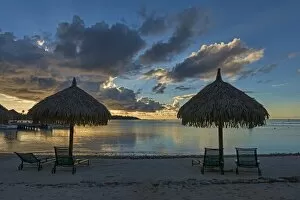 Images Dated 11th March 2013: Parasols and sun loungers on the beach, evening atmosphere, Moorea, French Polynesia