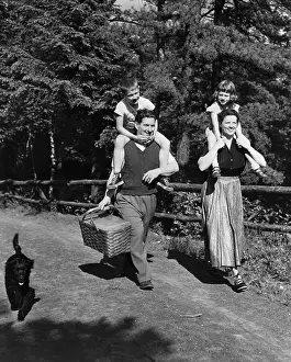 Quality Time Prints: Parents Carrying Children for Picnic