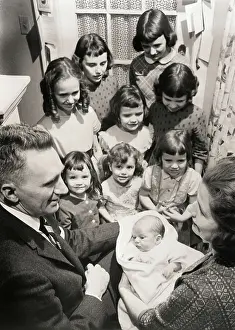 Parents Prints: Parents with family of Girls Look at baby boy