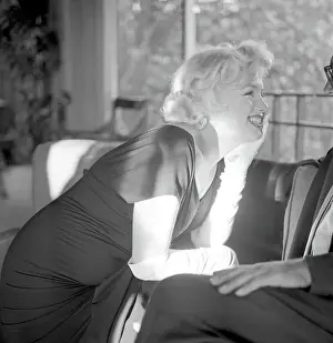 Prints of BEVERLY HILLS, CA - JULY 8: Actress Marilyn Monroe attends a party held in her honor wearing a black dress and white gloves at the Beverly Hills Hotel on July 8, 1958 in Beverly Hills, California Marilyn Monroe: The Iconic Muse Prints: Party For Marilyn At Beverly Hills Hotel