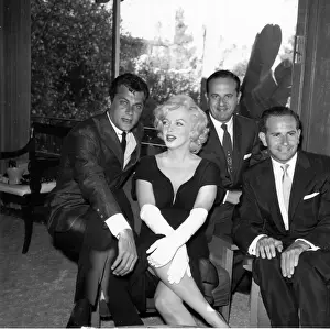 Prints of BEVERLY HILLS, CA - JULY 8: Actress Marilyn Monroe attends a party held in her honor wearing a black dress and white gloves at the Beverly Hills Hotel on July 8, 1958 in Beverly Hills, California Marilyn Monroe: The Iconic Muse Prints: Party For Marilyn At Beverly Hills Hotel
