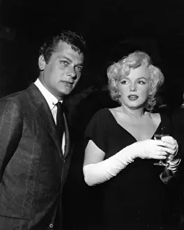 Prints of BEVERLY HILLS, CA - JULY 8: Actress Marilyn Monroe attends a party held in her honor wearing a black dress and white gloves at the Beverly Hills Hotel on July 8, 1958 in Beverly Hills, California Marilyn Monroe: The Iconic Muse Prints: Party For Marilyn At Beverly Hills Hotel