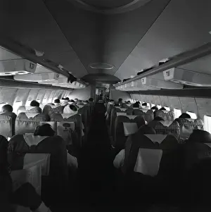 Seat Prints: Passengers on airplane, rear view