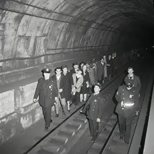 Tunnel Prints: Passengers Being Lead Through Subway