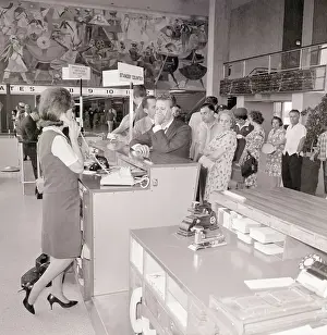 Passengers in Line at Airline Counter