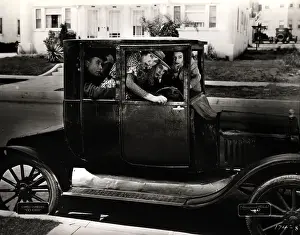 Coupe Prints: Passengers Packed in Old Car