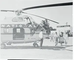 Passengers Preparing to Board Helicopter