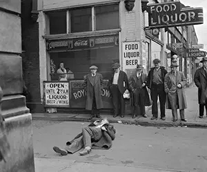 Passersby Observing a Man in the Street