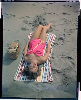 Pat Hall Lying on Beach
