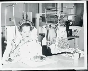 Poliomyelitis Prints: Two Patients Eating Their Food with the Help of Specialized Equipment