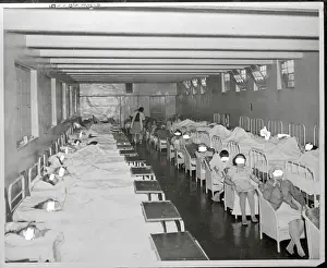 Patients Sitting in Chairs Near Others in Beds