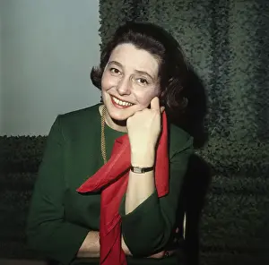 Patricia Neal Holding Red Scarf and Smiling for Camera