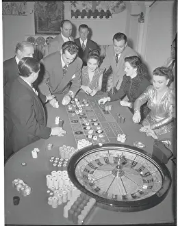 Patrons Watching Roulette Game