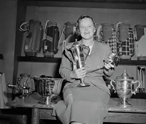 Patty Berg Holding Her Trophies