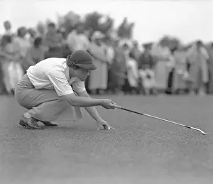 Patty Berg Lining up to Hit Golf Ball
