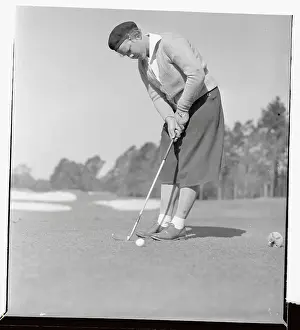Aiken Prints: Patty Berg Putting on Golf Course