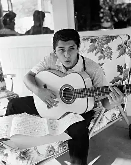 Paul Anka Practices Singing with Guitar