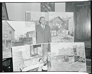 Douglas Prints: Paul Douglas Posing with Photographs