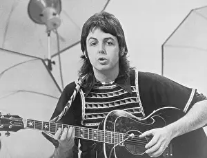 Paul McCartney Playing Guitar